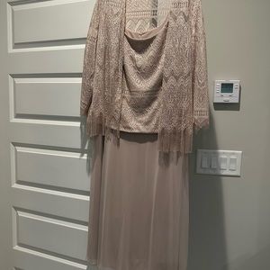 Beautiful formal ladies dress mid-length.  the threads sparkle. Worn once.